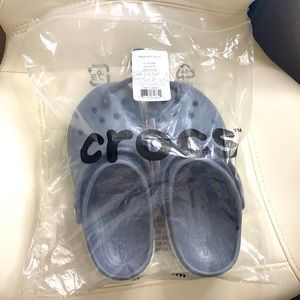 Brand new kids Crocs. Gray, green and white. New in original package w/ tags.